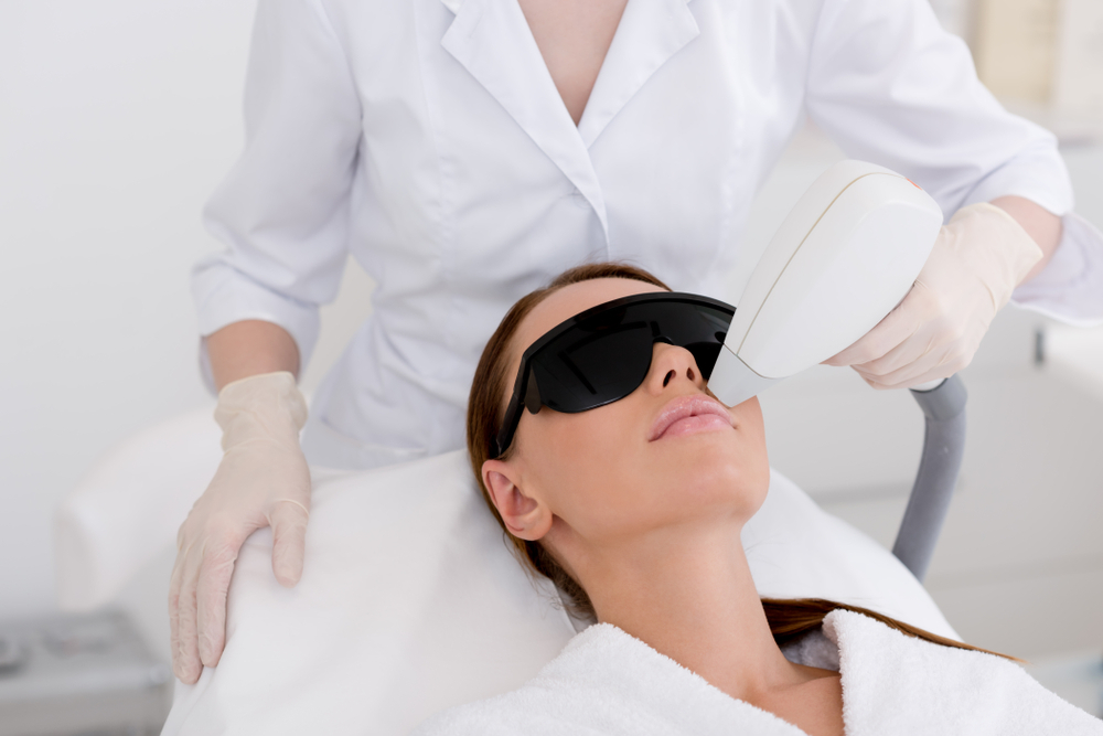 Woman-getting-face-laser-treatment